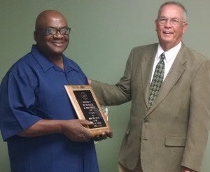 Becky Crissman/Cordele DispatchCordele City Commission Chairman Zack Wade presents a plaque to Jessie Mercer for over 50 years of service.